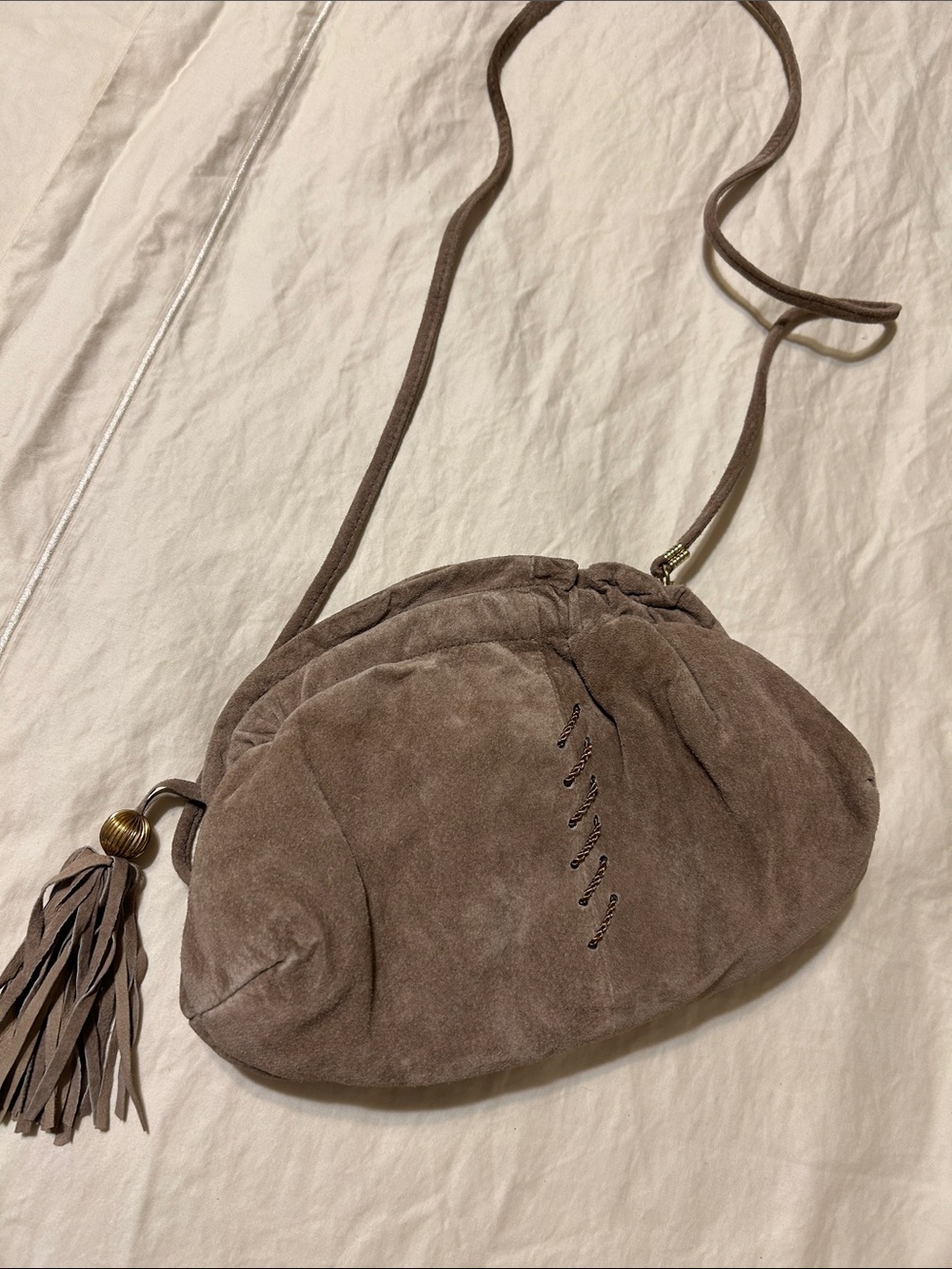 Taupe Suede Tassel Drawstring Crossbody Bag
